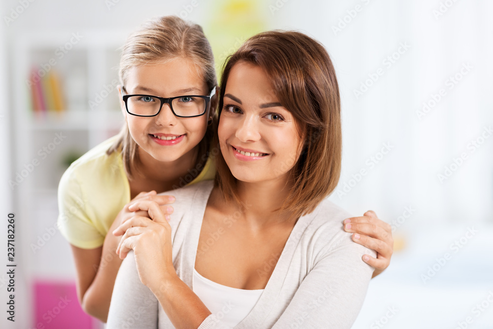 people and family concept - portrait of happy mother and daughter at home people and family concept - portrait of happy mother and daughter at home