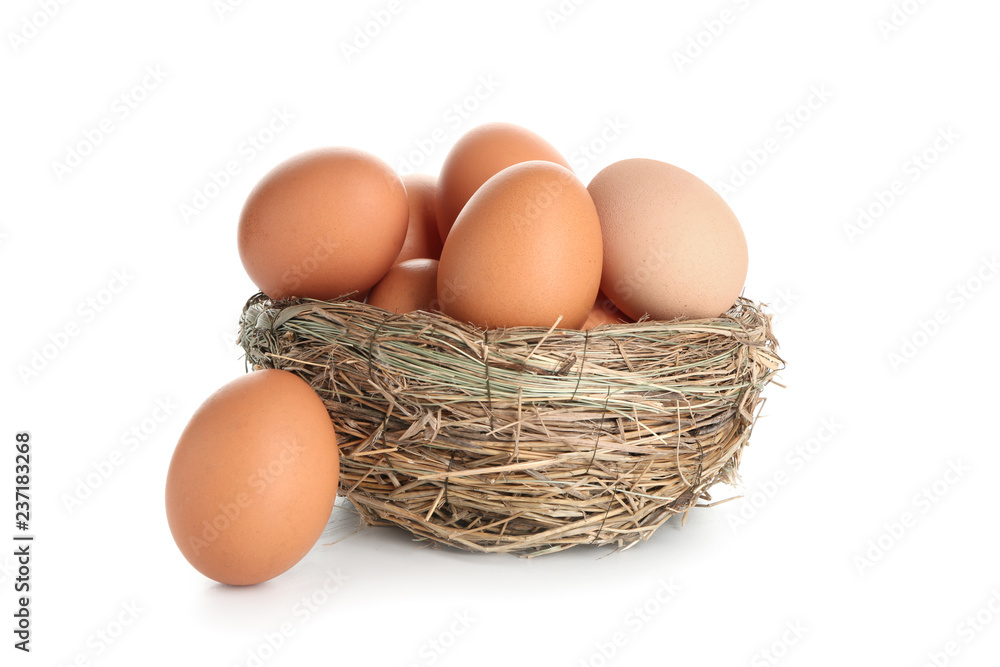 Nest with raw brown chicken eggs on white background Nest with raw brown chicken eggs on white background