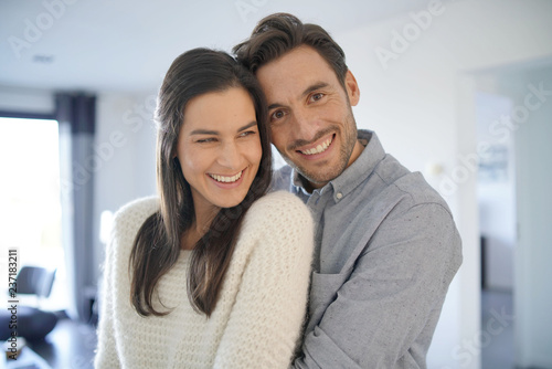  Portrait of gorgeous couple embracing at home