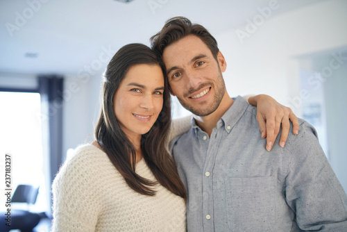  Portrait of gorgeous couple embracing at home