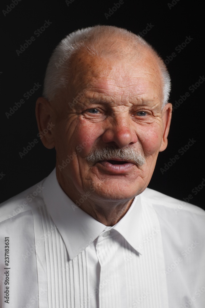 Positive old man in white shirt Positive old man in white shirt