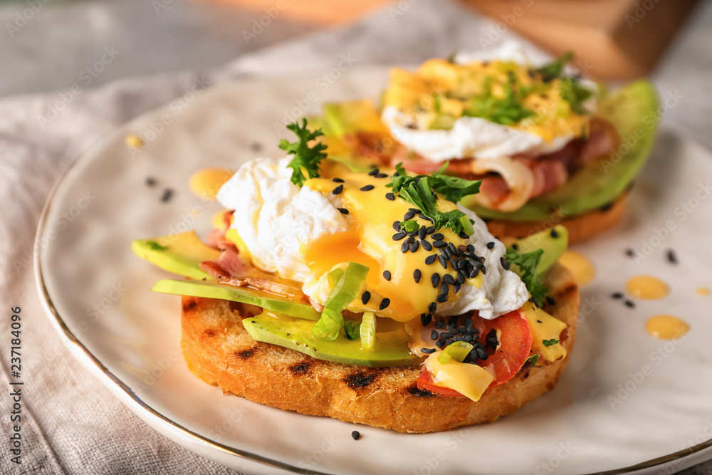 Tasty eggs Benedict on plate Tasty eggs Benedict on plate
