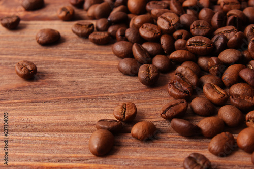 coffee beans on wood background. Aromatic coffee, coffee drinks