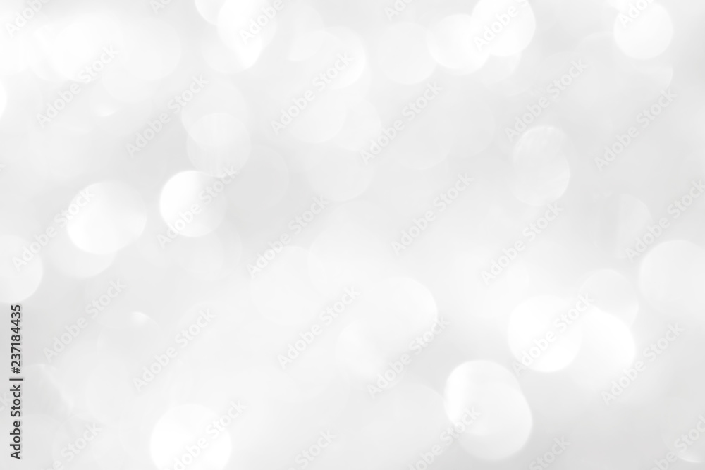 Shiny white background with Christmas patterns of balls and circles, light blur. Texture pattern in gray colors for wrapping a holiday card or wallpaper. Shiny white background with Christmas patterns of balls and circles, light blur. Texture pattern in gray colors for wrapping a holiday card or wallpaper.
