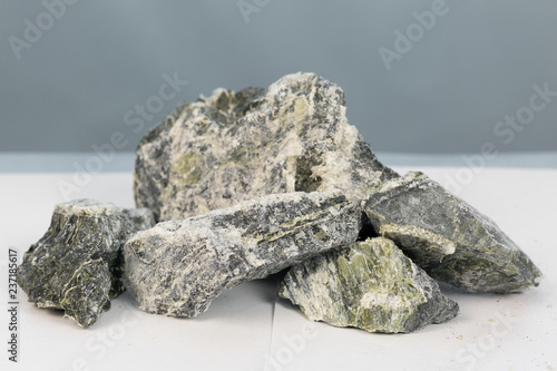 Dangerous mineral asbestos stone with fiber. Mineral asbestos in the composition of the stone enclosing rock. © ALEXEY