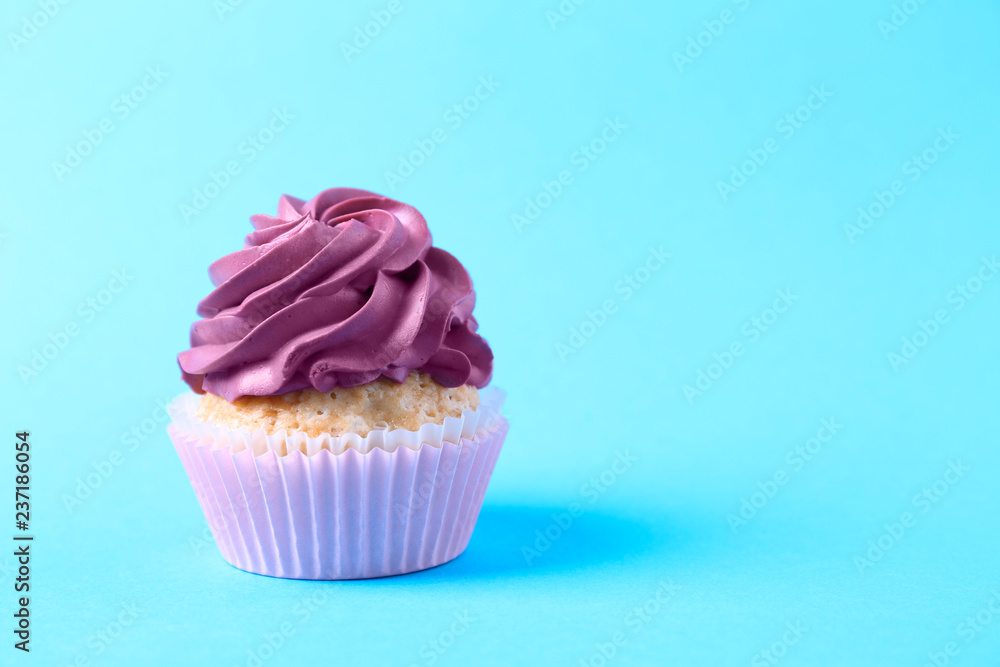 Tasty cupcake on color background Tasty cupcake on color background