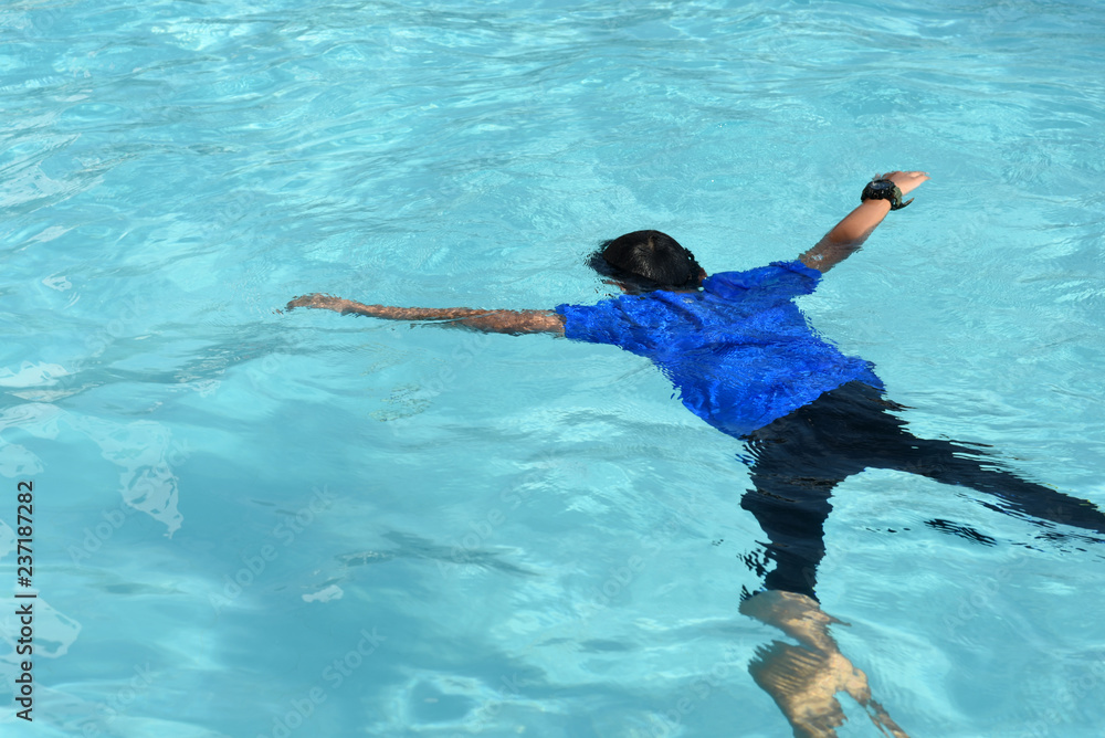 floating body of a drowned male children in swimming pool. concept of  safety Stock Photo | Adobe Stock