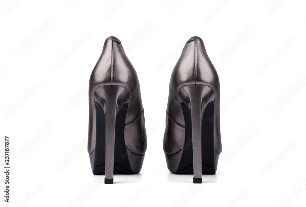 Silver woman shoes with high heels on white background Silver woman shoes with high heels on white background