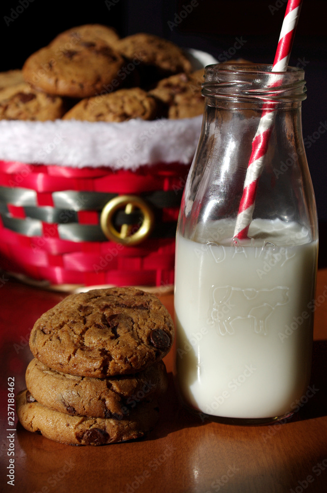 Christmas cookies in basket with milk and red paper straw Christmas cookies in basket with milk and red paper straw