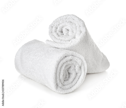 Clean rolled towels on white background