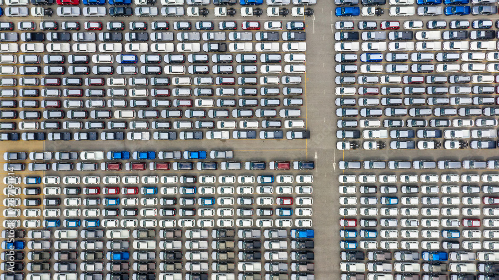 Obraz premium Cars export terminal in export and import business and logistics. Shipping cargo to harbor. Water transport International. Aerial view and top view.