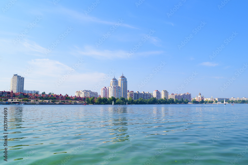 Fototapeta premium View across the river at home in the city.