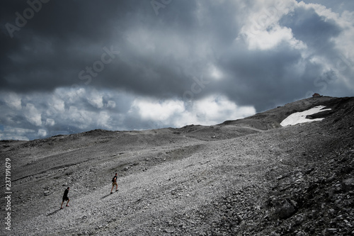 Two backpacker friends are hiking up at the Stelvio to the summit (ID: 237191679)