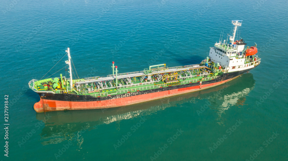 Obraz premium Oil tanker, gas tanker in the high sea.Refinery Industry cargo ship,aerial view,Thailand, in import export, LPG,oil refinery, Logistics and transportation with working crane bridge in harbor