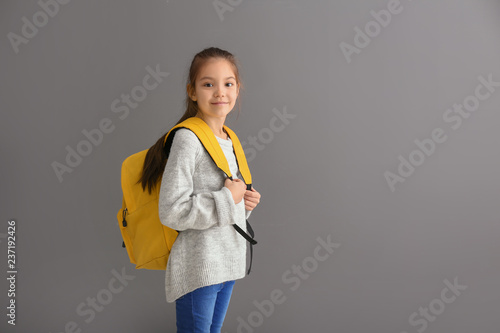 Cute girl with backpack on ...