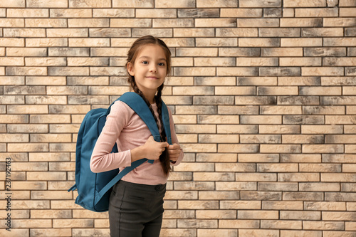 Cute girl with backpack on ...