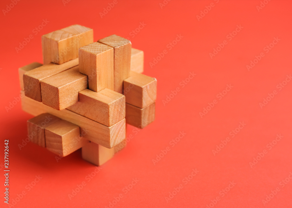 Wooden puzzle on color background Wooden puzzle on color background