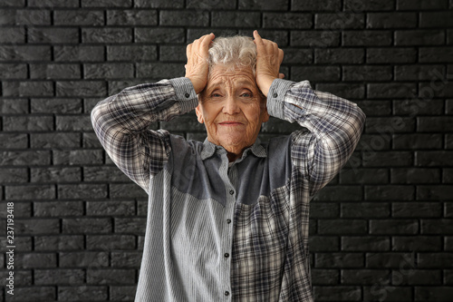 Portrait of elderly woman a...