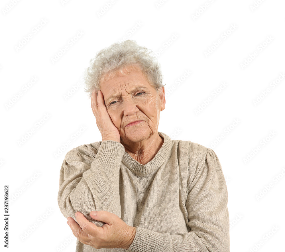Senior woman suffering from headache on white background Senior woman suffering from headache on white background