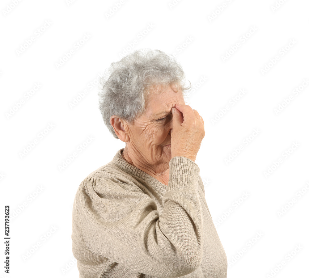Senior woman suffering from headache on white background Senior woman suffering from headache on white background