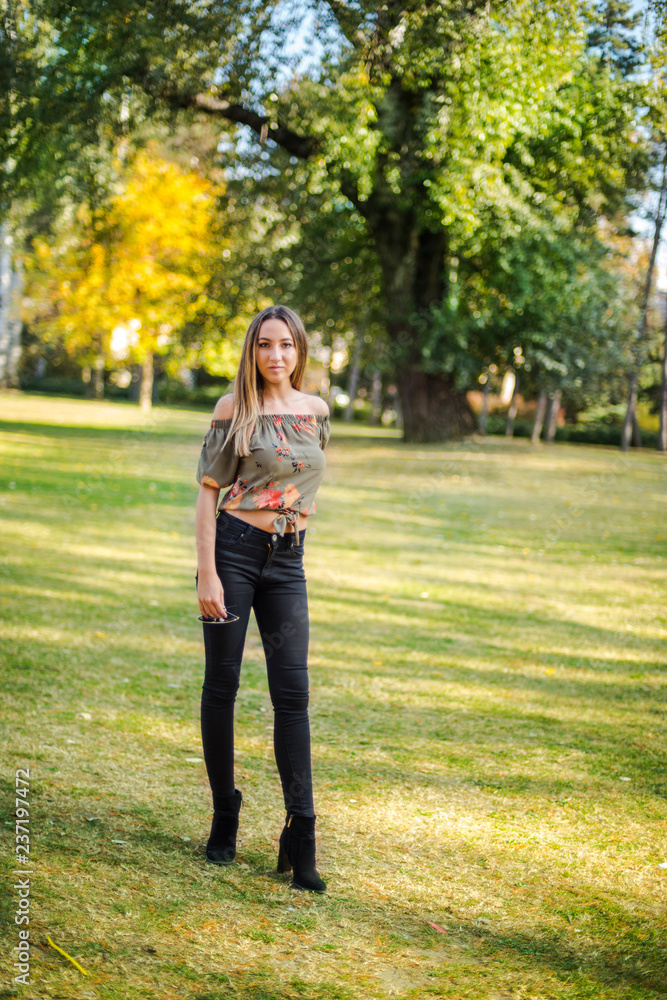 Photographing a girl during autumn with a blurred background Photographing a girl during autumn with a blurred background