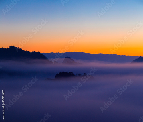 Morning sunrise over mist .