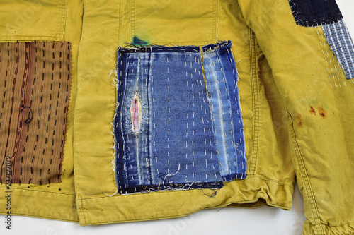 Wallpaper Mural Khaki vintage jacket with patchwork decor sashiko detail, on a white background Torontodigital.ca