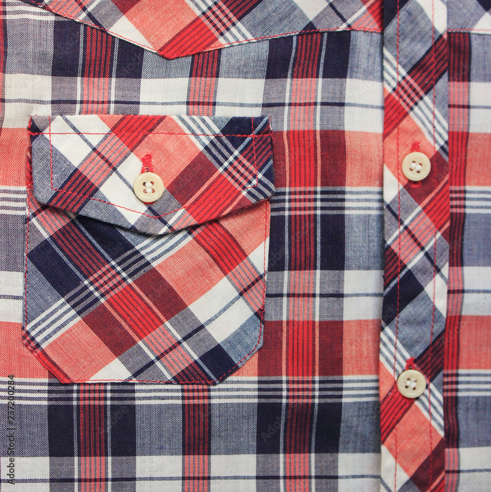 Plaid Tartan Pattern Shirt with Blue, White & Red Checkered Fabric. Close Up View of Front Pocket and Buttons on Stylish Fashion Polo T-Shirt. Squared Simple Colorful Design on Casual Sweater Jacket Plaid Tartan Pattern Shirt with Blue, White & Red Checkered Fabric. Close Up View of Front Pocket and Buttons on Stylish Fashion Polo T-Shirt. Squared Simple Colorful Design on Casual Sweater Jacket