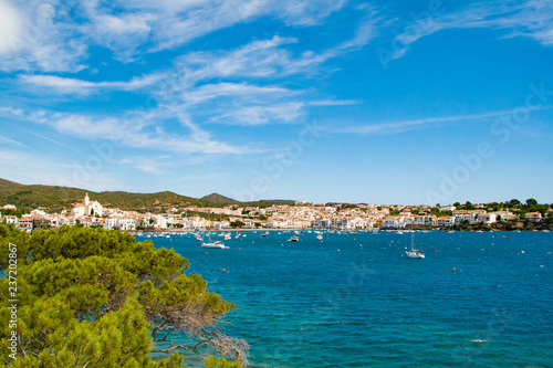 Fototapeta Naklejka Na Ścianę i Meble -  Sea landscape with Cadaques, Catalonia, Spain near of Barcelona. Scenic old town with nice beach and clear blue water in bay. Famous tourist destination in Costa Brava with Salvador Dali landmark