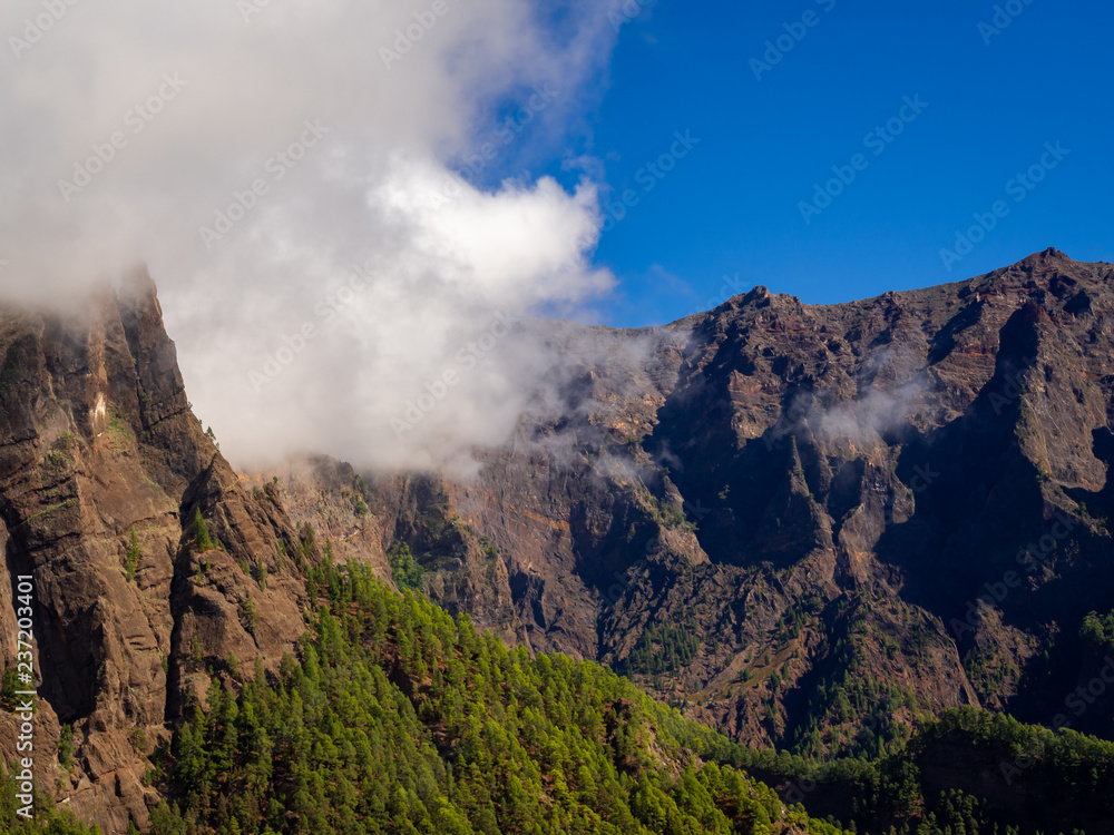 Clouds moving over mountainous terrain