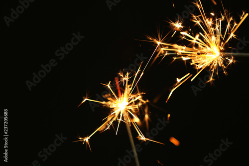 Festive Christmas sparklers on dark background