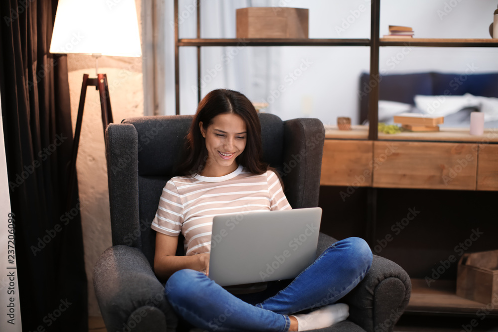 Young woman working with laptop at home Young woman working with laptop at home