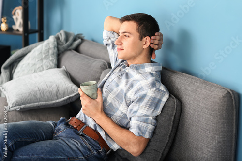 Relaxed young man enjoying ...