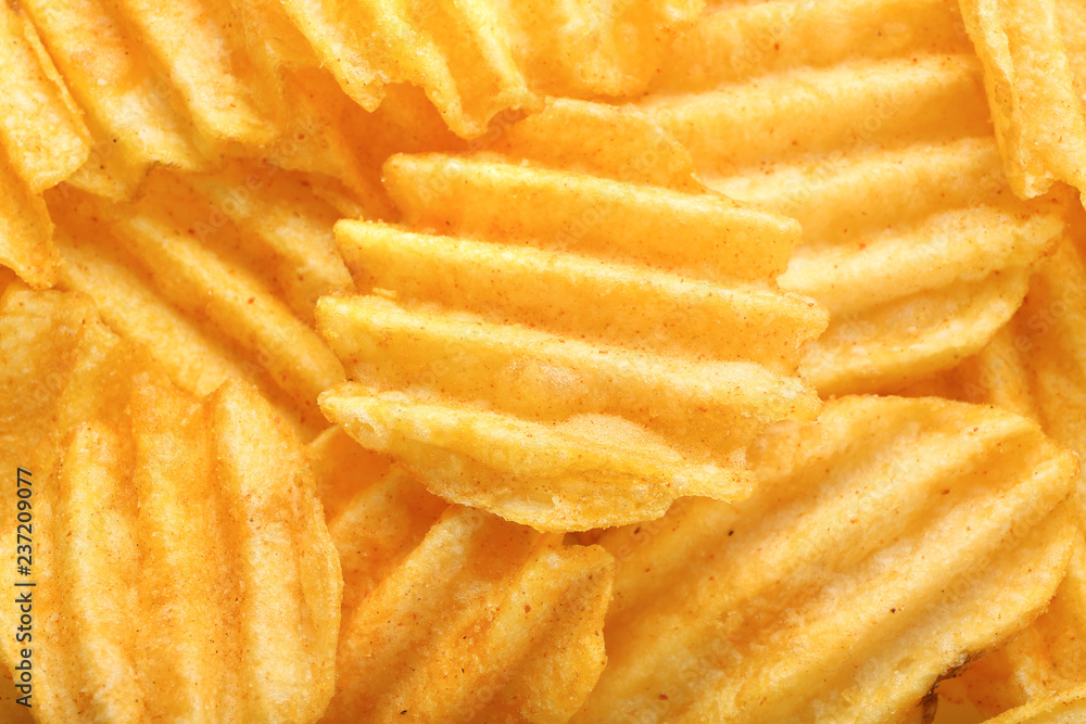 Many tasty crispy potato chips, closeup Many tasty crispy potato chips, closeup