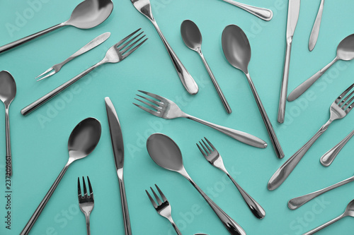 Set of cutlery on color background, flat lay