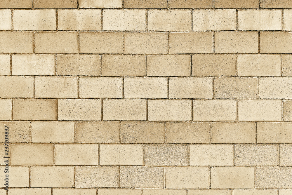 Naklejka premium Old beige stone wall background texture