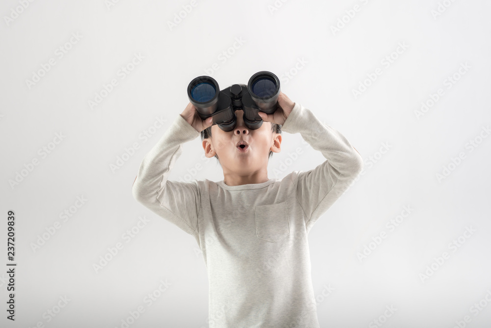 Boy holding binoculars