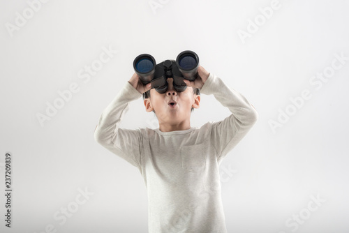Boy holding binoculars