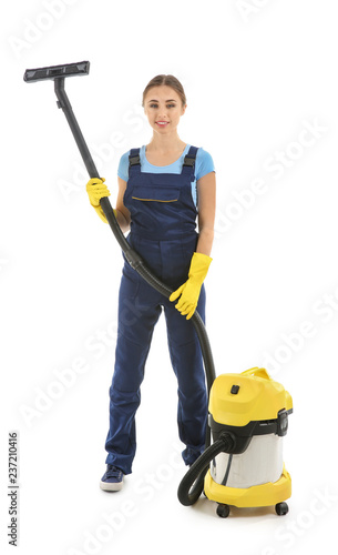 Woman with vacuum cleaner o...