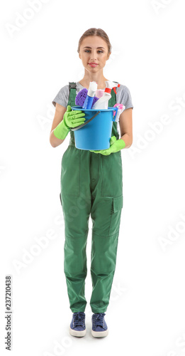 Woman with cleaning supplies on white background