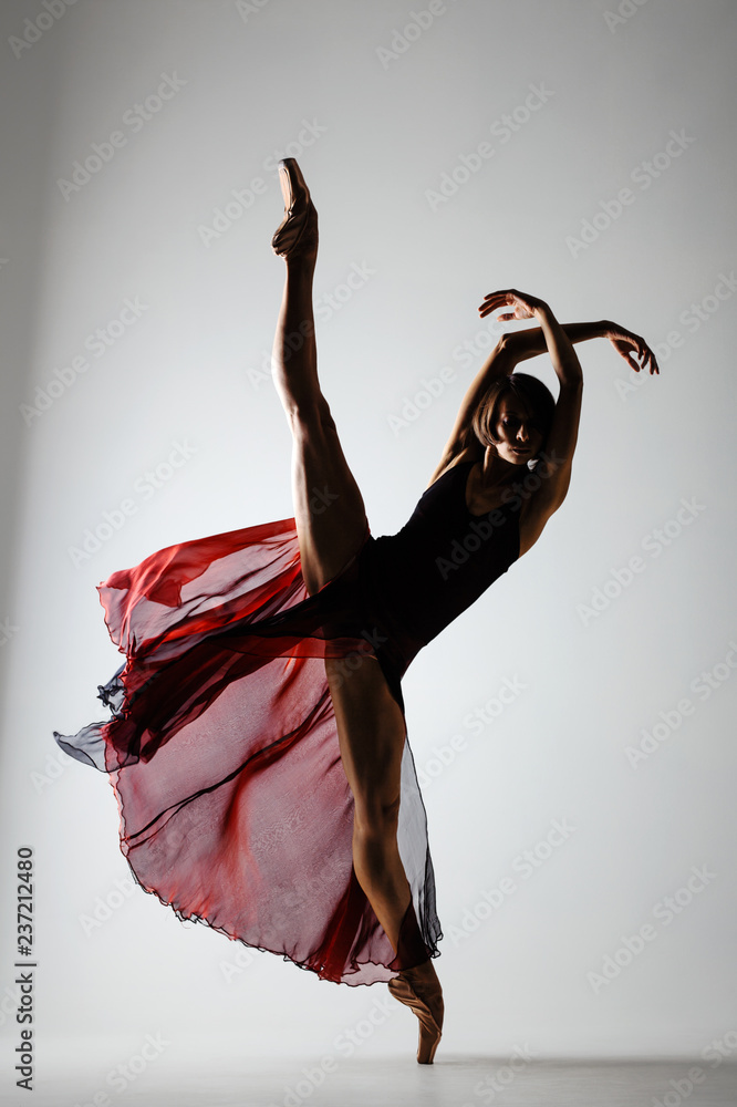 Fototapeta premium ballerina with a waving red dress