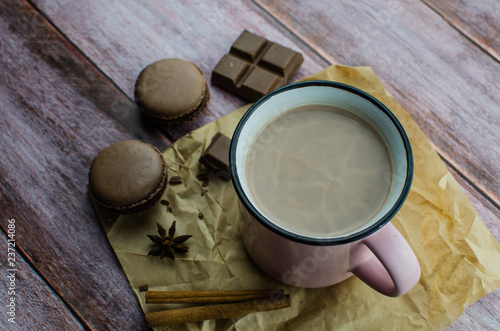 Cocoa drink with spices  zephyr on wooden background