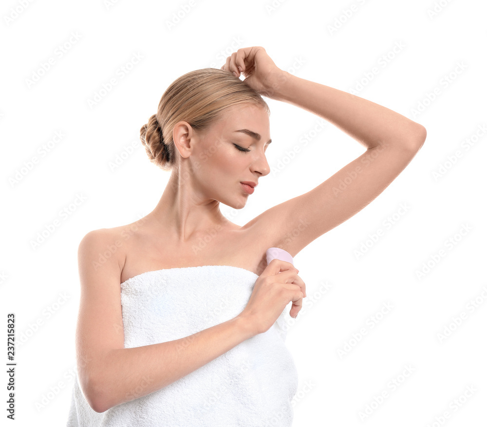 Beautiful young woman with deodorant on white background Beautiful young woman with deodorant on white background