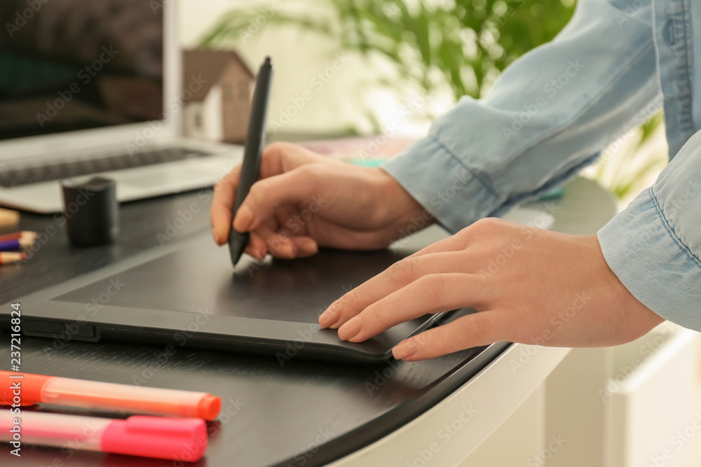Young designer working in office, closeup