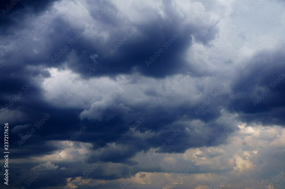 sky with white fluffy and rainy dark clouds after rain. Background texture.  