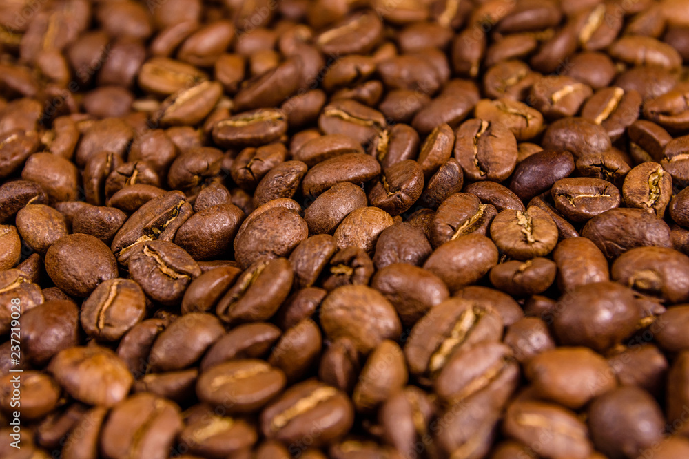 Background of many roasted coffee beans. Selective focus Background of many roasted coffee beans. Selective focus