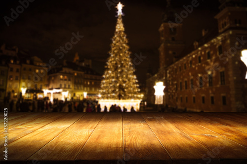 Table background and christmas tree at night 