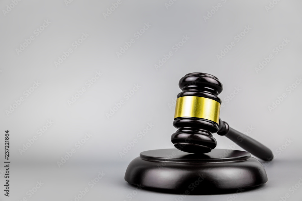 Judges gavel on gray background Judges gavel on gray background