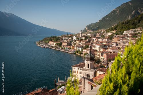 Wonderful view of the Garda lake and Limone town from the top point on a sunny summer morning