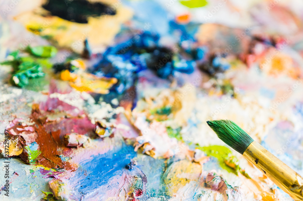 Art brush and palette with oil paints. Soft focus Art brush and palette with oil paints. Soft focus